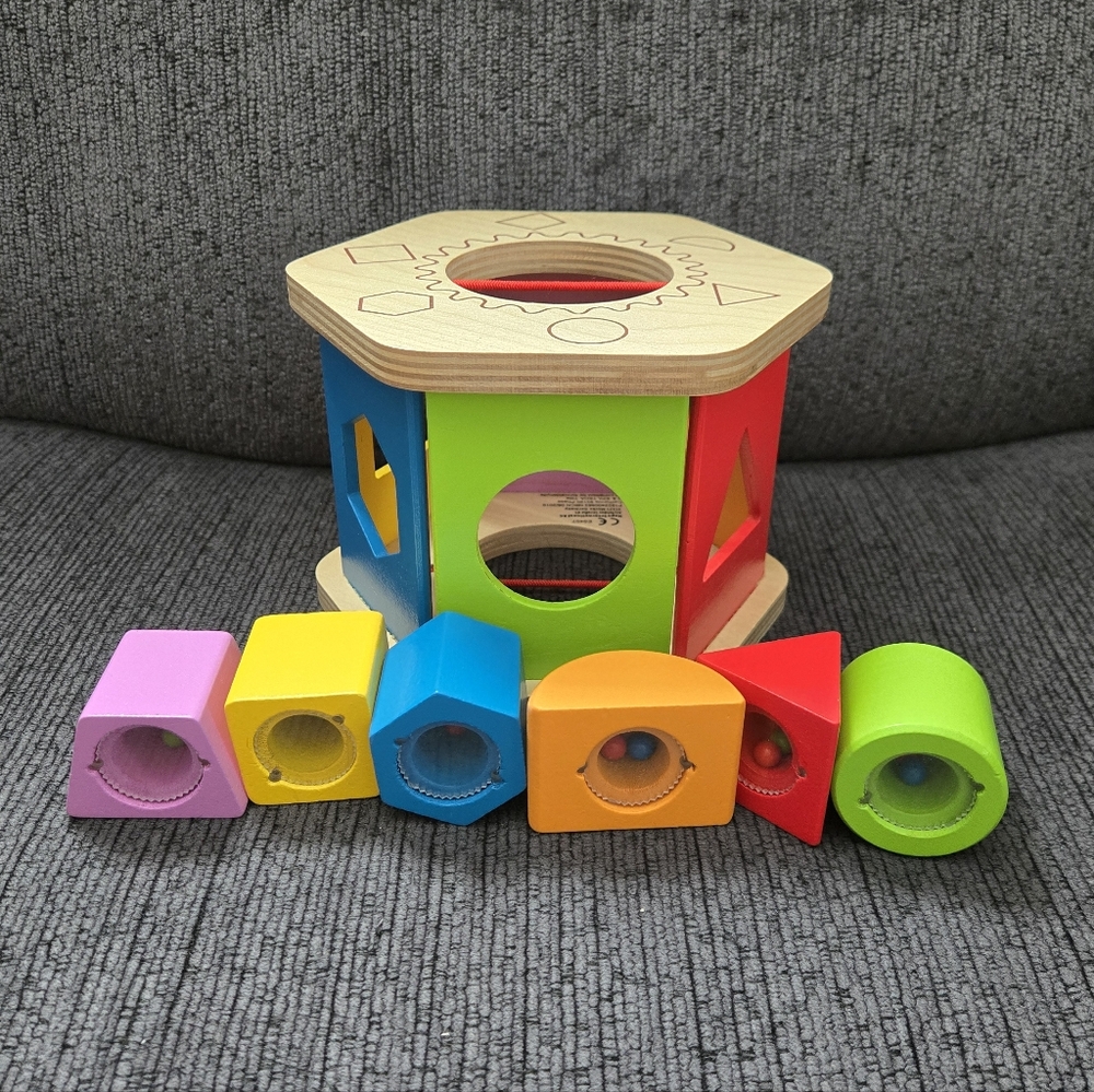 Hape Shake and Match Shape Sorter toy.